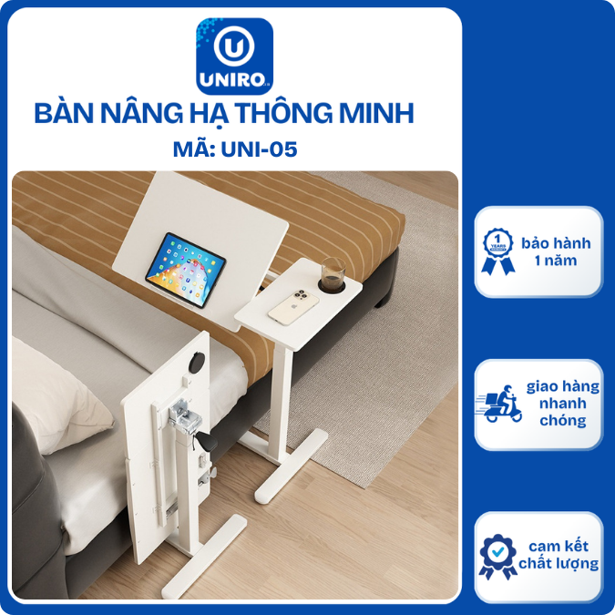 Bàn nâng hạ cạnh giường ngủ tại nhà, cạnh ghế sofa, mặt bàn có khả năng xếp gọn khi không dùng.